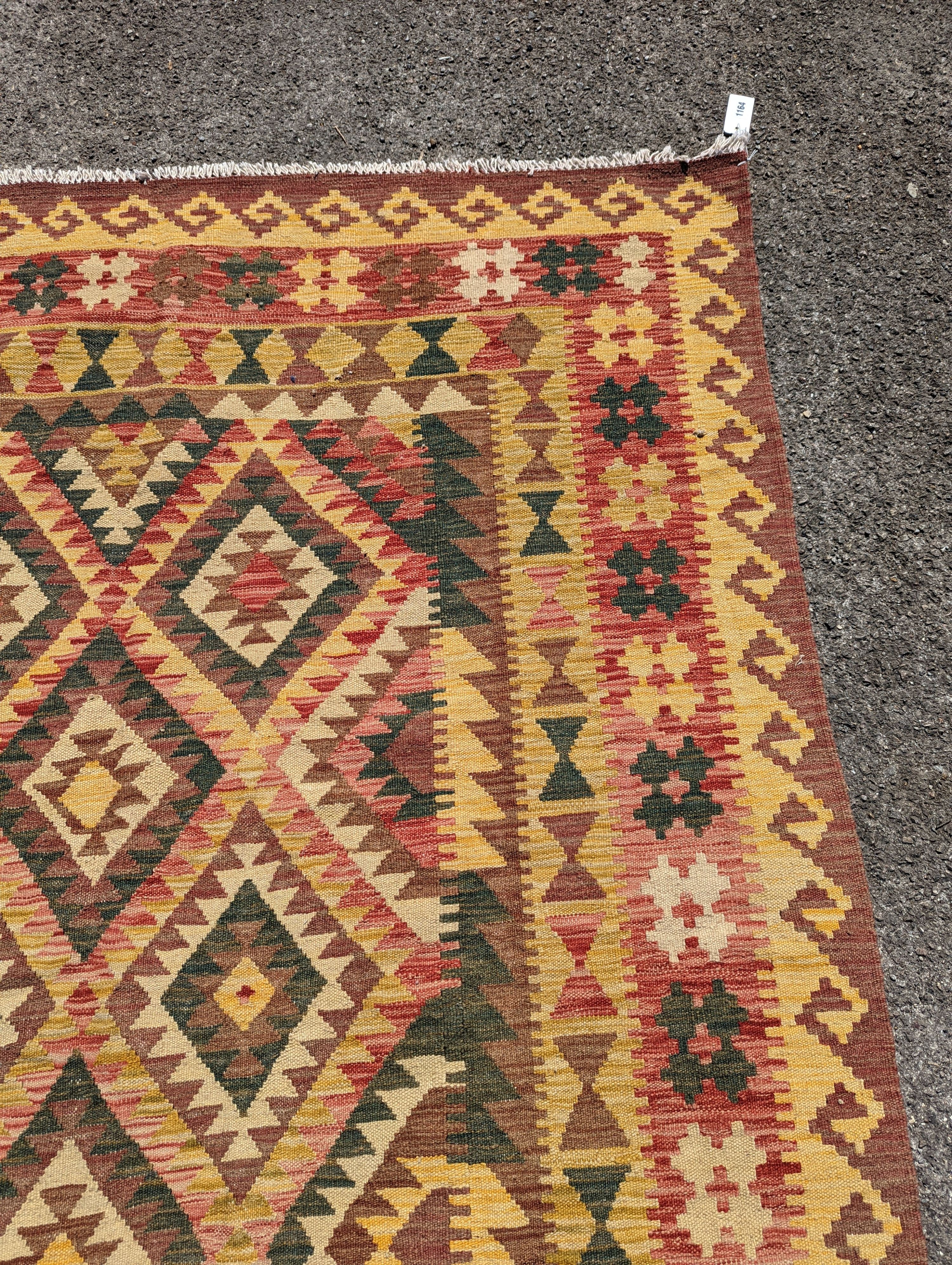 An Anatolian design polychrome geometric flatweave Kilim rug, 215 x 157cm
